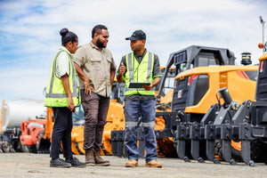 HBS staff in dealership yard